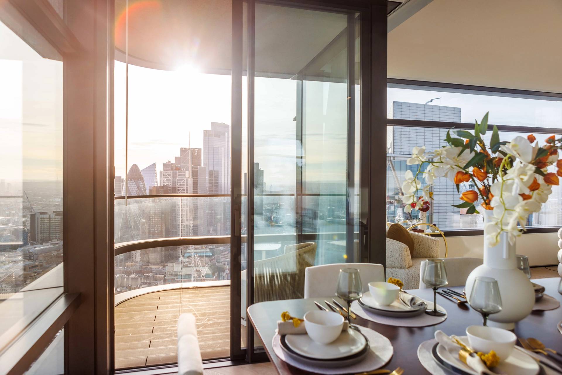 Sunset view from a penthouse dining balcony over East London architecture, perfect for romantic brand storytelling, Love Locations.