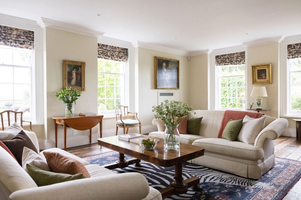 Love Locations bright stately home lounge Steyning: Light-filled formal sitting room with sash windows, antique furniture, and neutral tones, perfect for editorial fashion photography and interview sets.