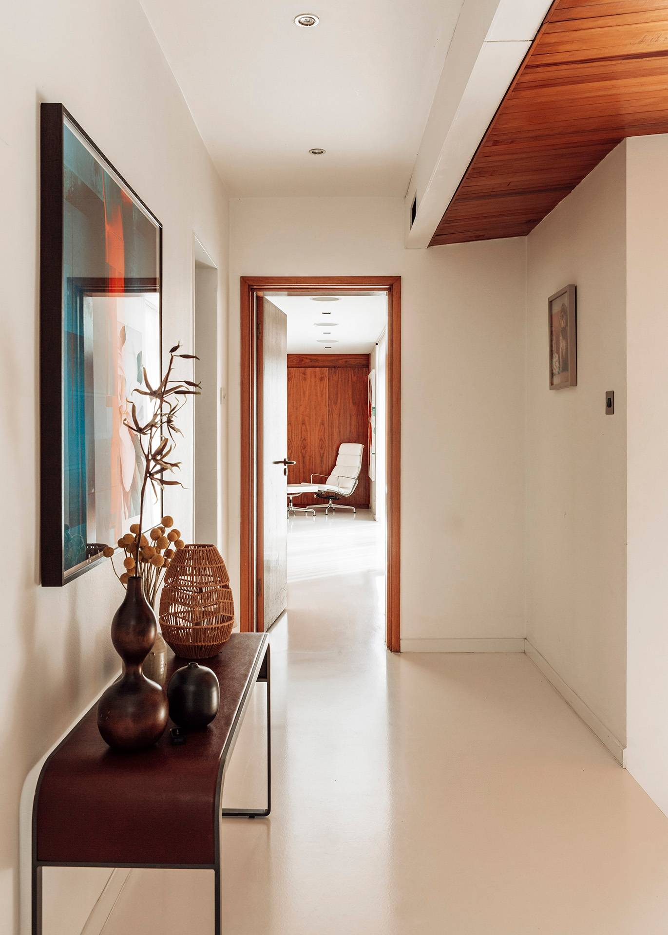 Bright interior hallway corridor leading toward a tranquil bedroom retreat in a mid-century Bromley home, Love Locations.