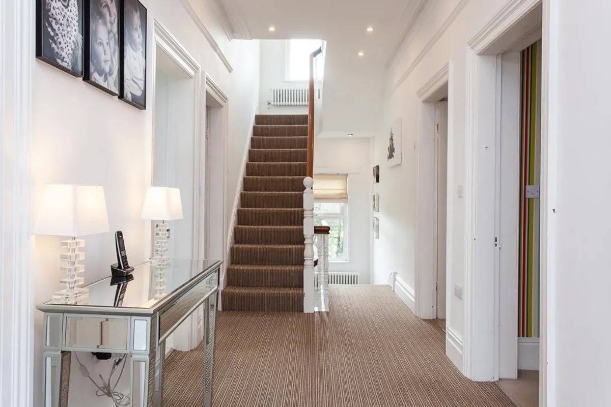 Bright entrance hallway and staircase shoot location in a detached family home in Stockport SK6 from Love Locations.