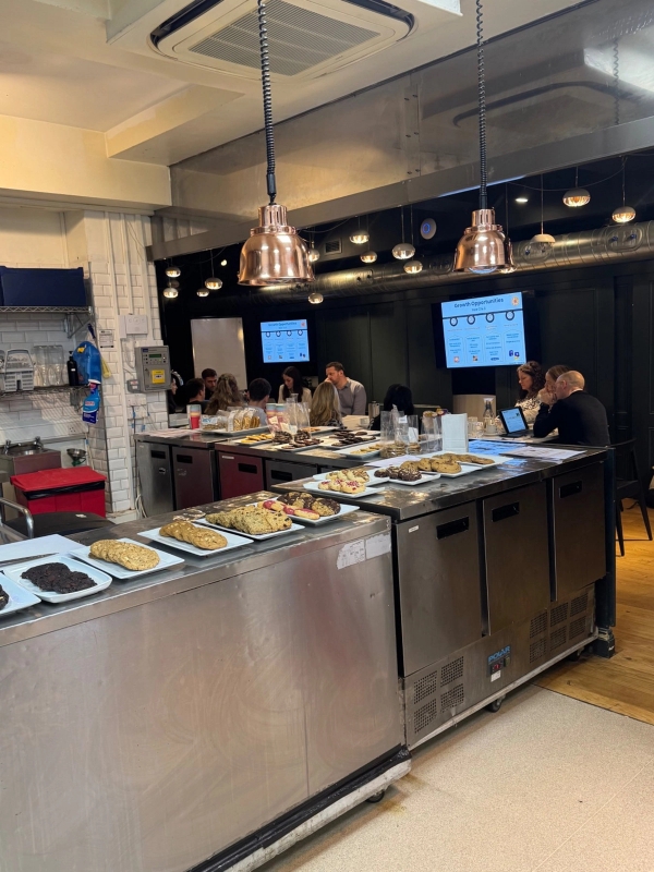 Modern kitchen event space setup featuring hot food counters and industrial styling for private parties, Love Locations London.