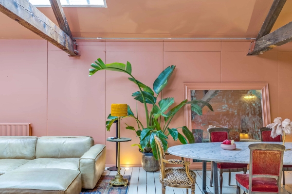 Bespoke dining room set with retro velvet chairs and lush green house plants for brand shoots, curated by Love Locations.