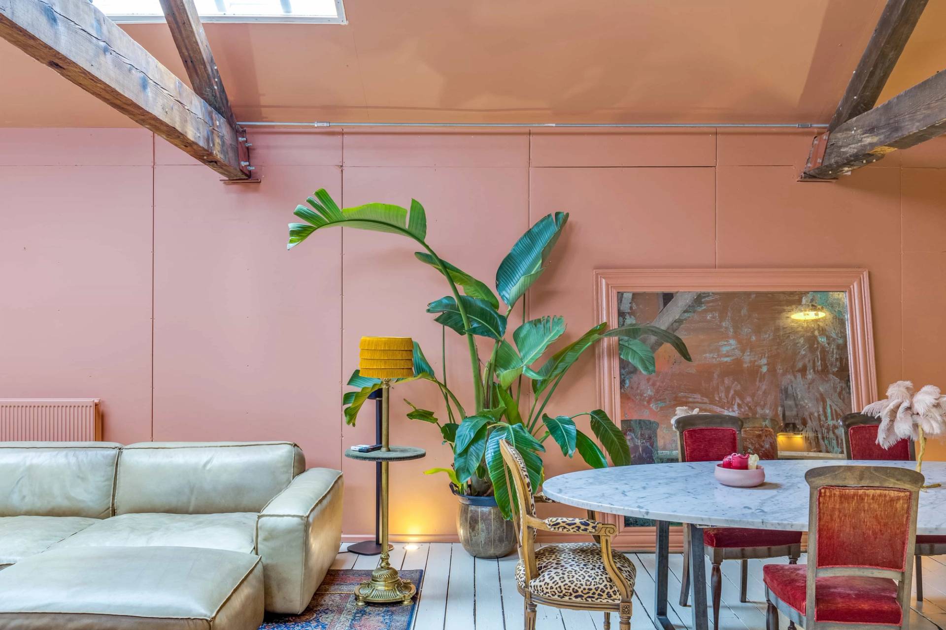 Bespoke dining room set with retro velvet chairs and lush green house plants for brand shoots, curated by Love Locations.