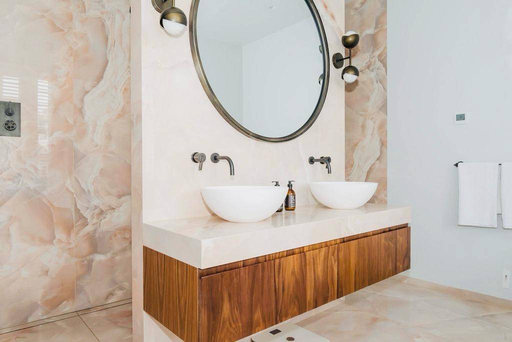 Double bathroom vanity unit with twin vessel sinks, wooden cabinets, and round wall mirrors, Love Locations TW11.