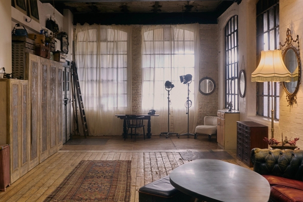 Vast multifunctional studio space in an 1890s former dental factory warehouse in EN5 featuring distressed wooden floors, crittall windows, and vintage studio lighting equipment, ideal for fashion lookbooks via Love Locations.