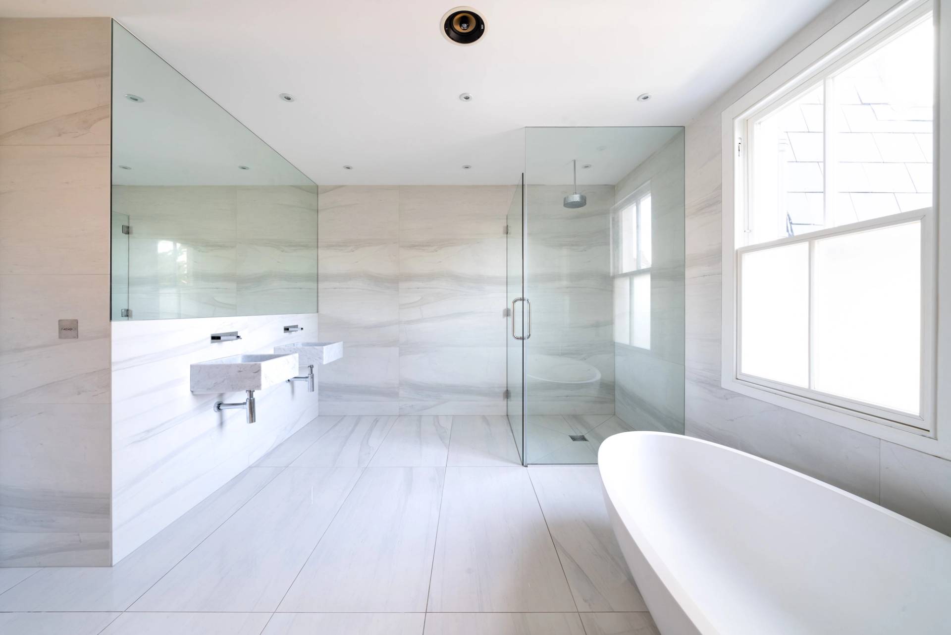 Modern bedroom featuring dark wood built-in wardrobes, white bedding, and light timber floorboards, Love Locations SW6.