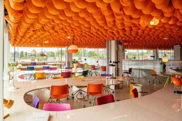 Contemporary creative workspace with large windows and colourful ceiling feature in Whitechapel E1 – love locations