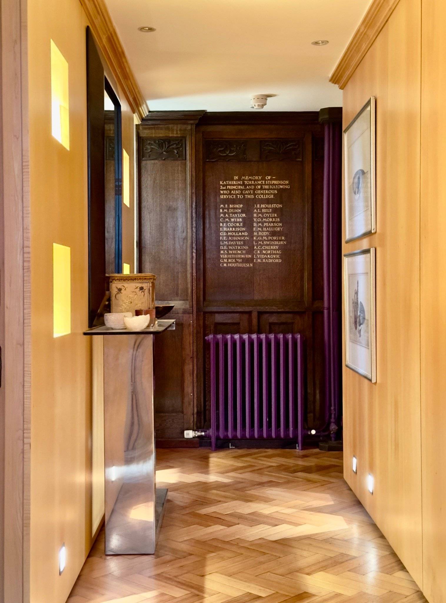 Warm wood-panelled entryway and corridor with an antique plaque inside a unique church conversion venue in Oval SE5 through Love Locations.