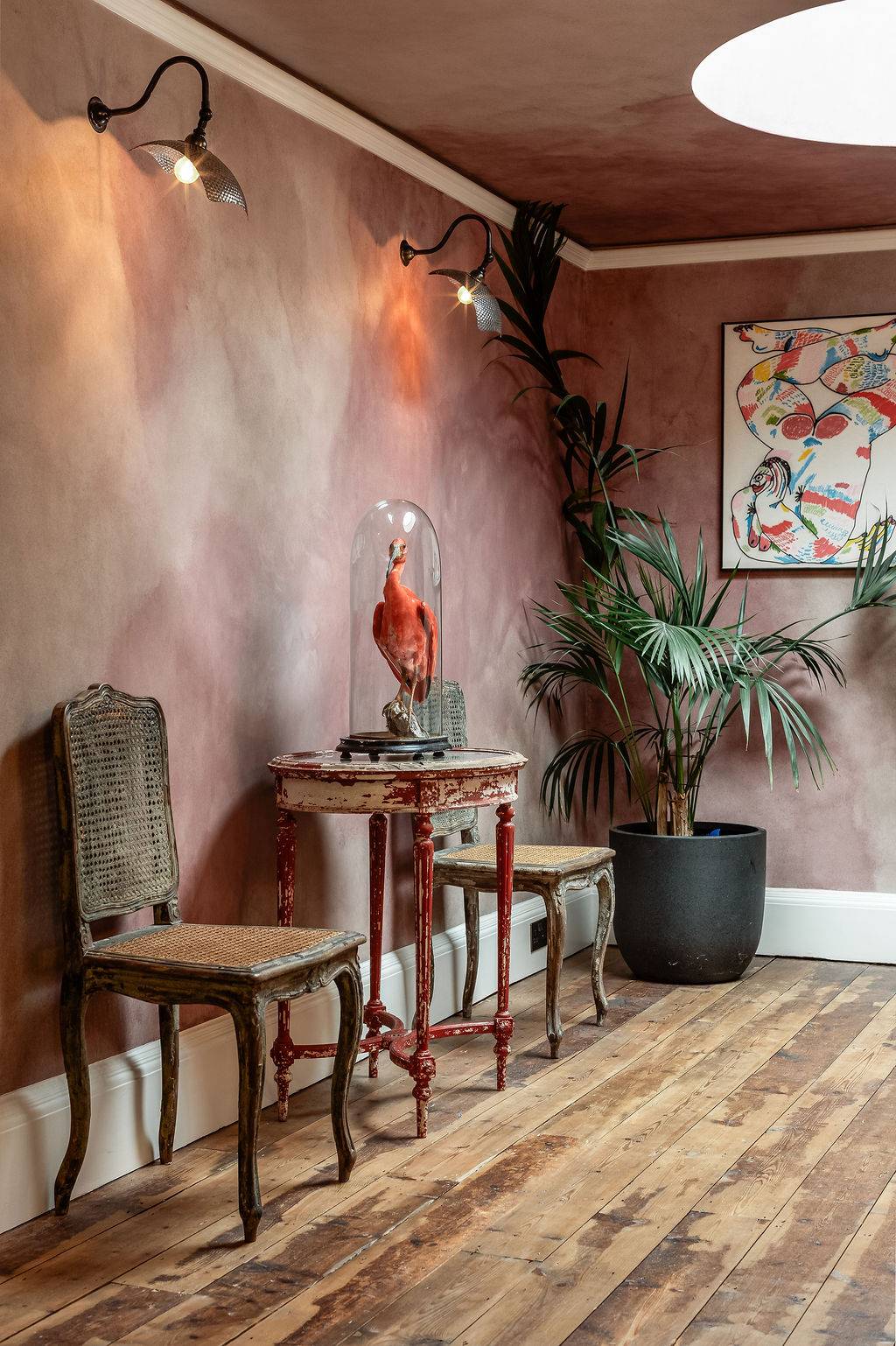 Eclectic hallway corner featuring textured wallpaper, a vintage wooden side table, and a classical side chair available through Love Locations.