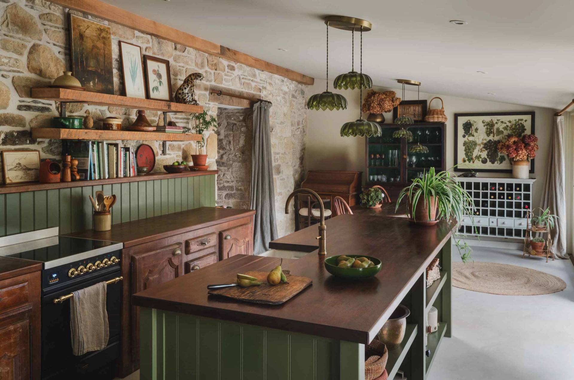 Warm kitchen island and timber counter shoot space in a historic Cornish manor in Newquay available through Love Locations.