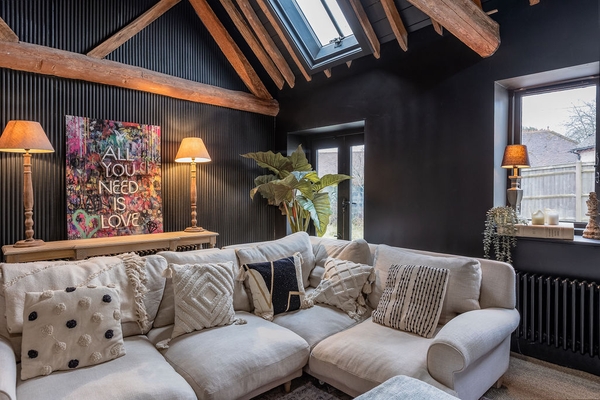 Love Locations airy living room with high vaulted ceilings.
