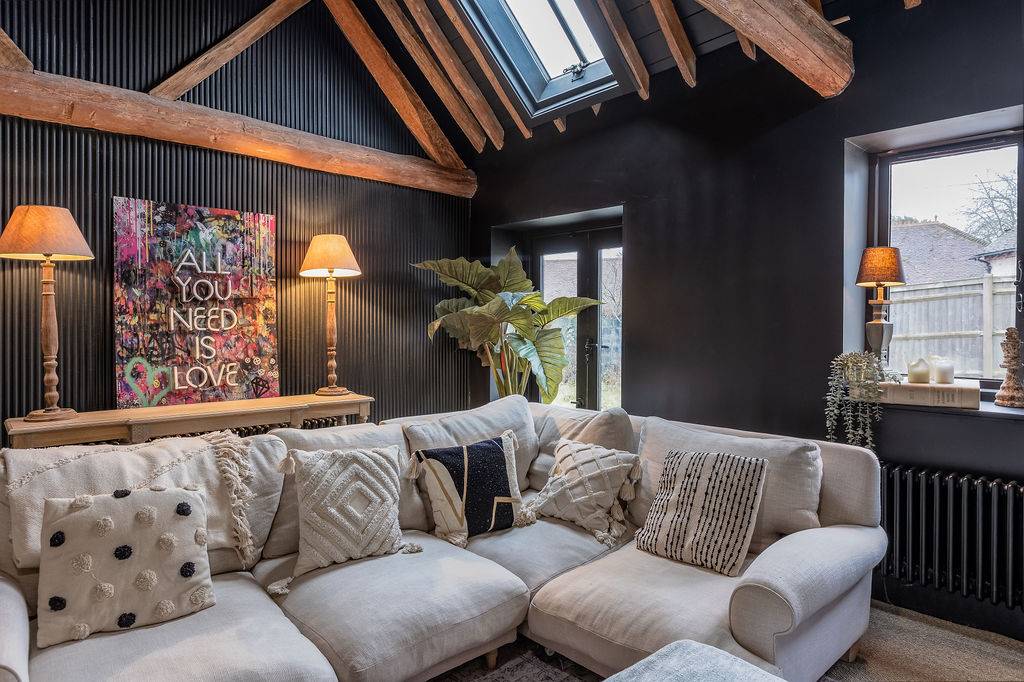 Love Locations airy living room with high vaulted ceilings.