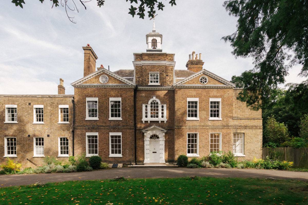 Grand Georgian brick mansion front facade shot featuring a central cupola clock tower and multi-pane sash windows in SE15, Love Locations.