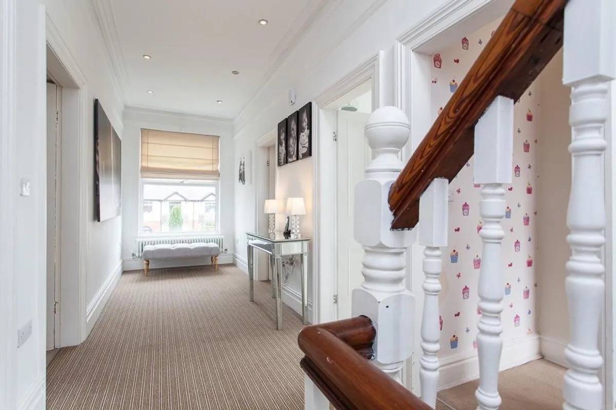 Characterful landing area and wooden banister staircase location in Stockport SK6 through Love Locations.