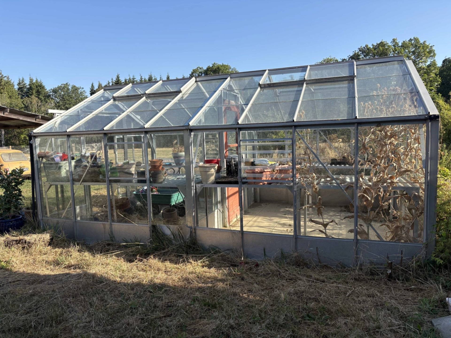 Large commercial greenhouse glasshouse structure set on rural farmland in Lewes, Love Locations BN8.