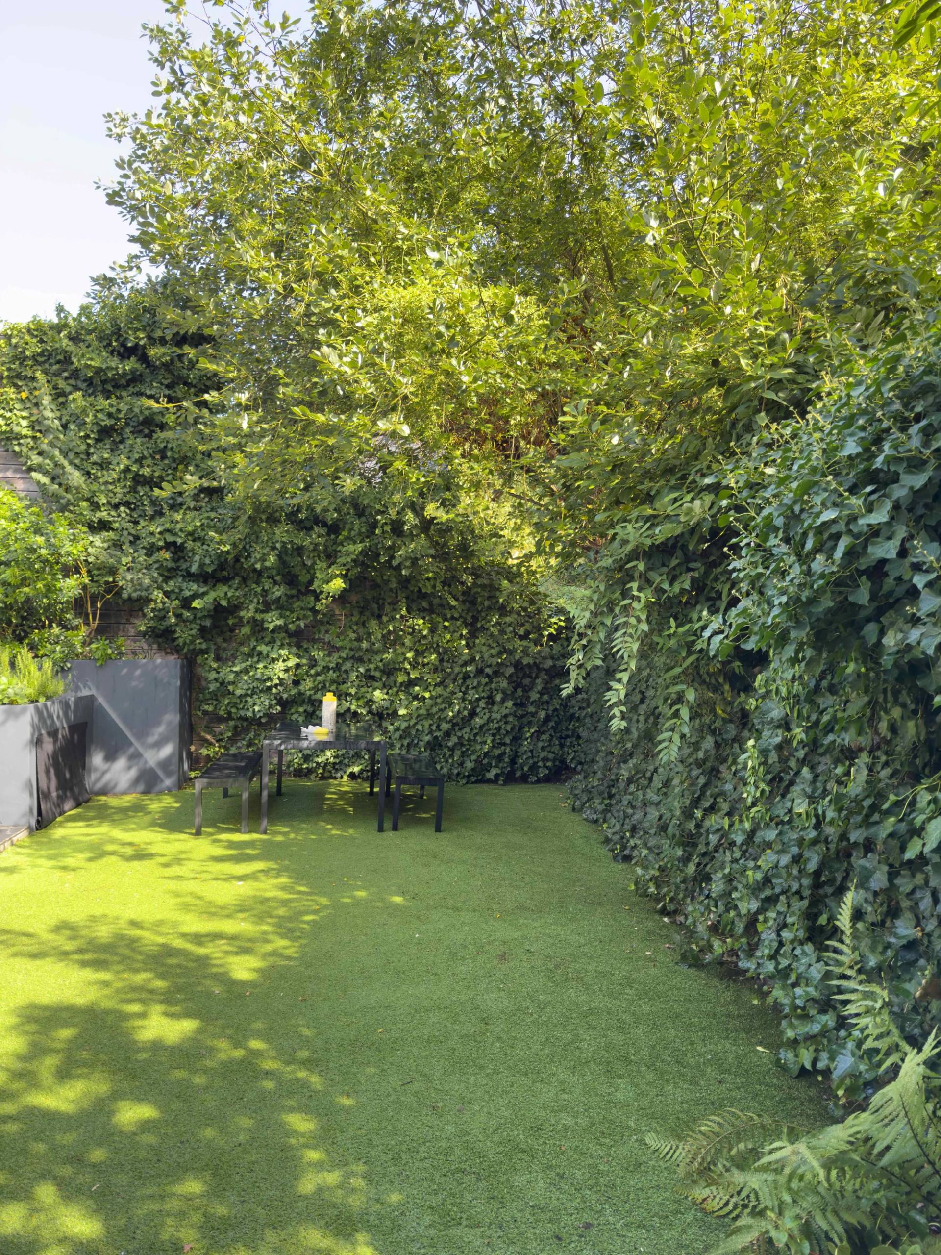 Landscaped garden at Love Locations Highgate Zen property with lush greenery.