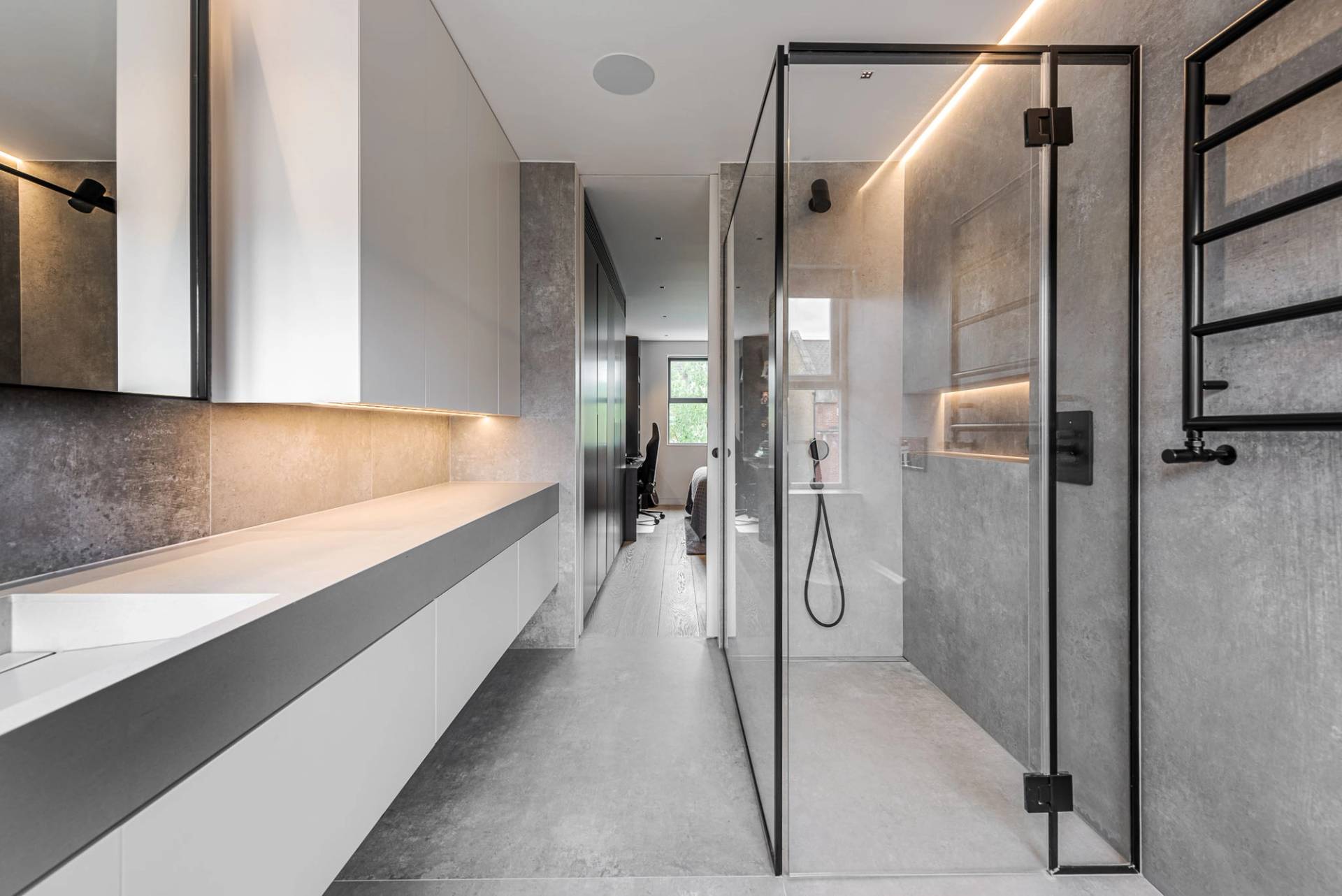 Modern walk-in shower room with grey marble tiles and recessed shower controls, Love Locations SW11.