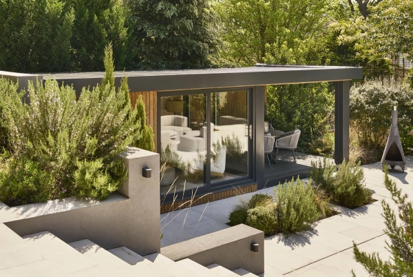 Luxury garden room outbuilding with sliding glass doors and minimalist landscaping, a unique shoot location by Love Locations.
