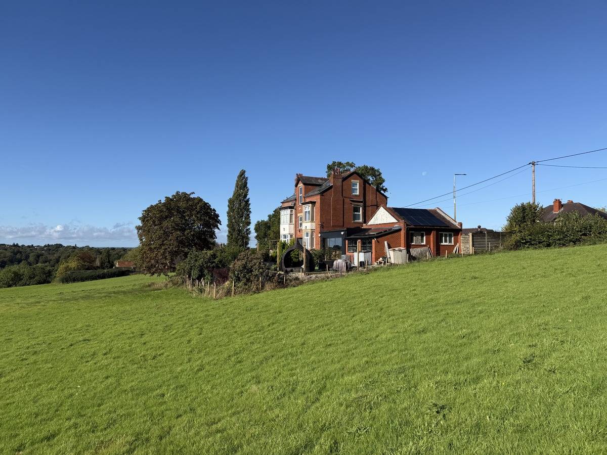 Picturesque countryside field backdrop surrounding a period property shoot location in Stockport SK6 through Love Locations.