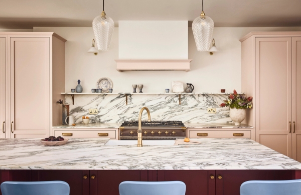 Marble backsplash wall detail set behind a professional Range cooker with brass wall taps, Love Locations SE21.