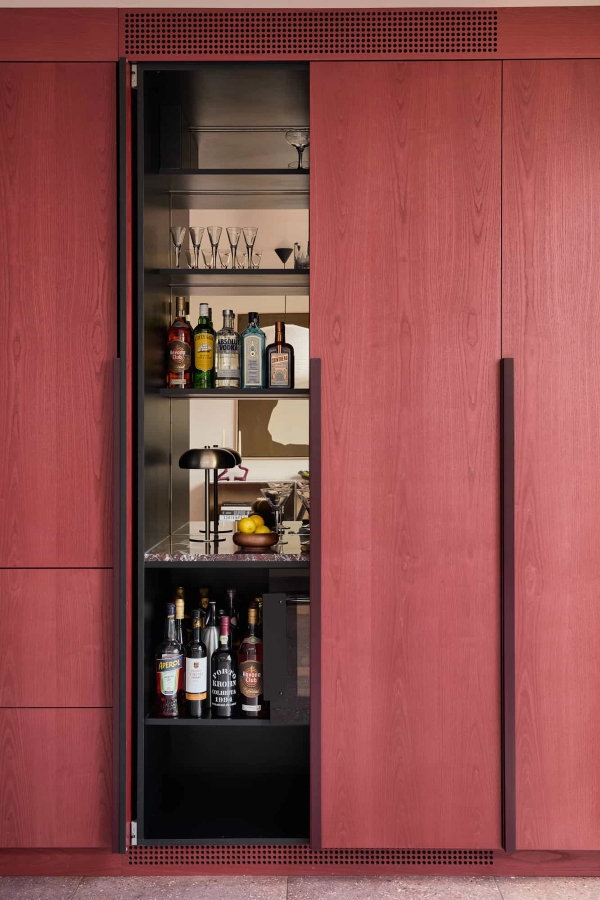 Love Locations luxury cocktail bar shoot space SE23: Fully integrated hideaway drinks larder lined with premium spirits and a mirror back panel, perfect for high-fashion lifestyle editorials.