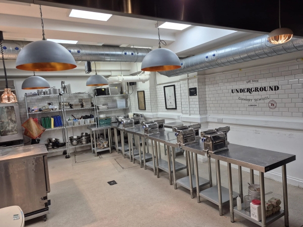 Professional cookery school kitchen layout with multiple workstations for television series or culinary masterclasses, Love Locations London.
