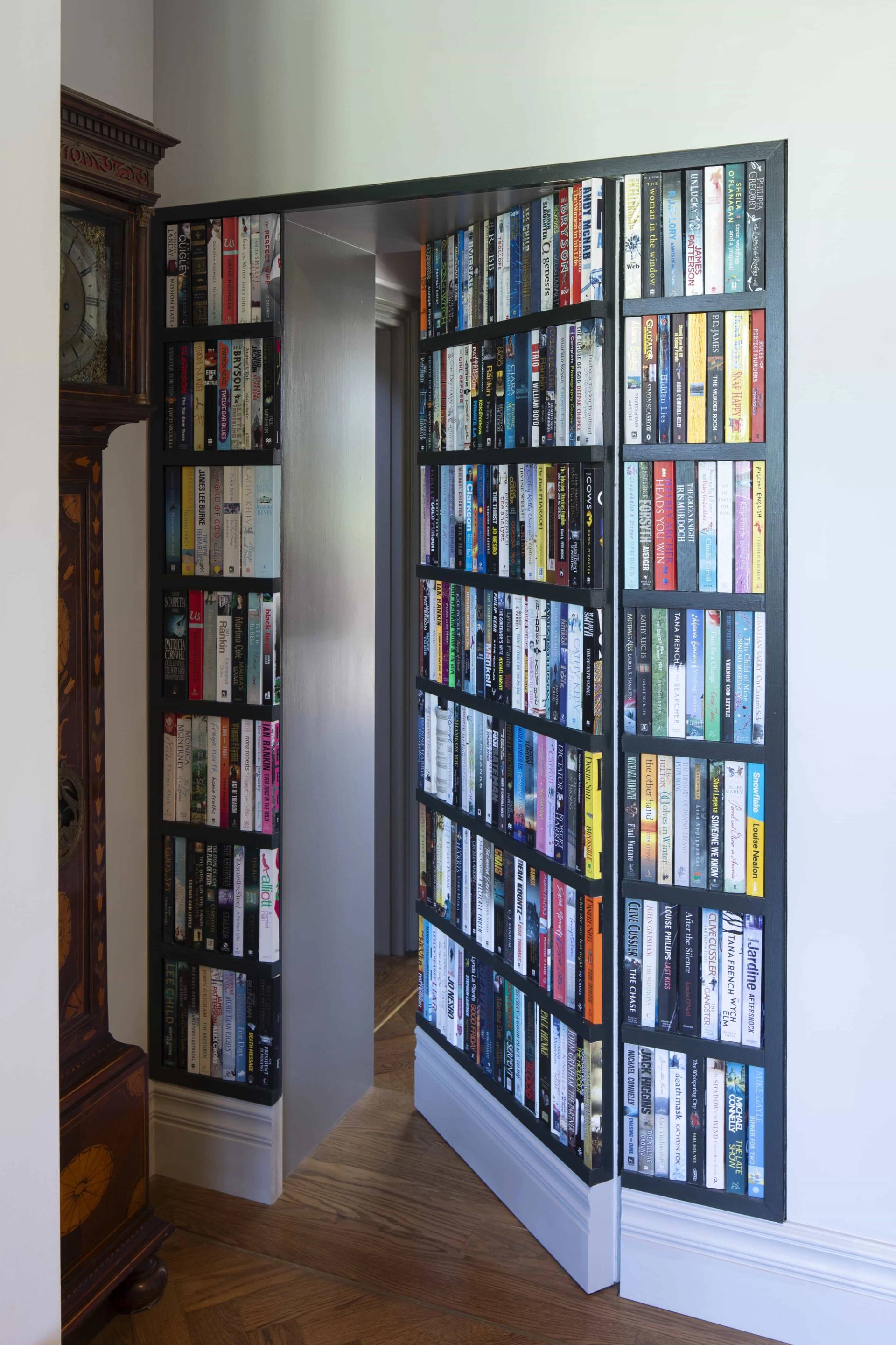 Secret bookshelf door opening into a hidden room in a luxury Oxfordshire location home, Love Locations OX7.