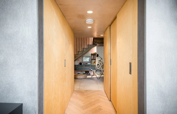 Minimalist hallway featuring contemporary plywood wall panels and clean architectural lines, listed on Love Locations SE1.