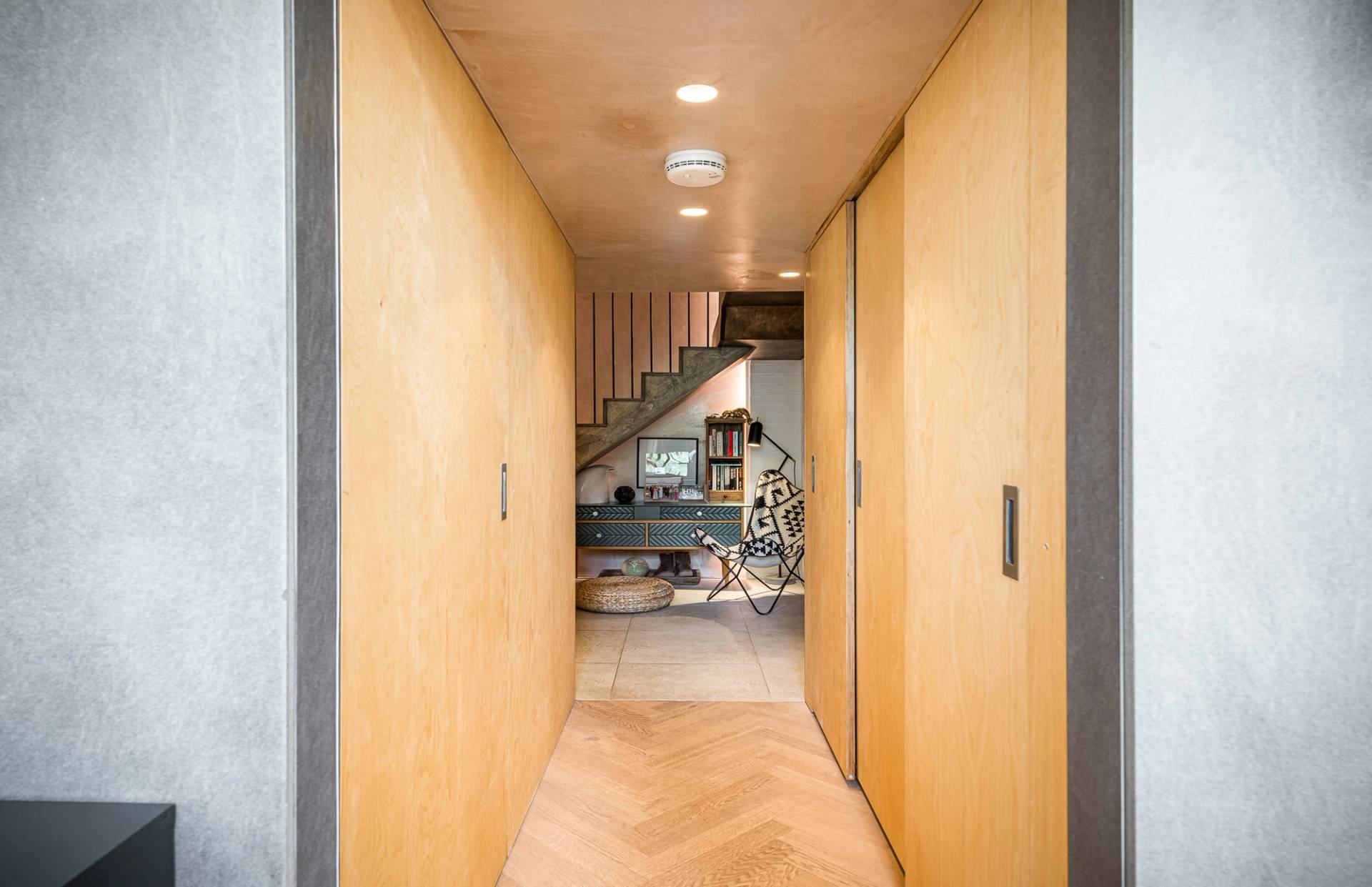 Minimalist hallway featuring contemporary plywood wall panels and clean architectural lines, listed on Love Locations SE1.