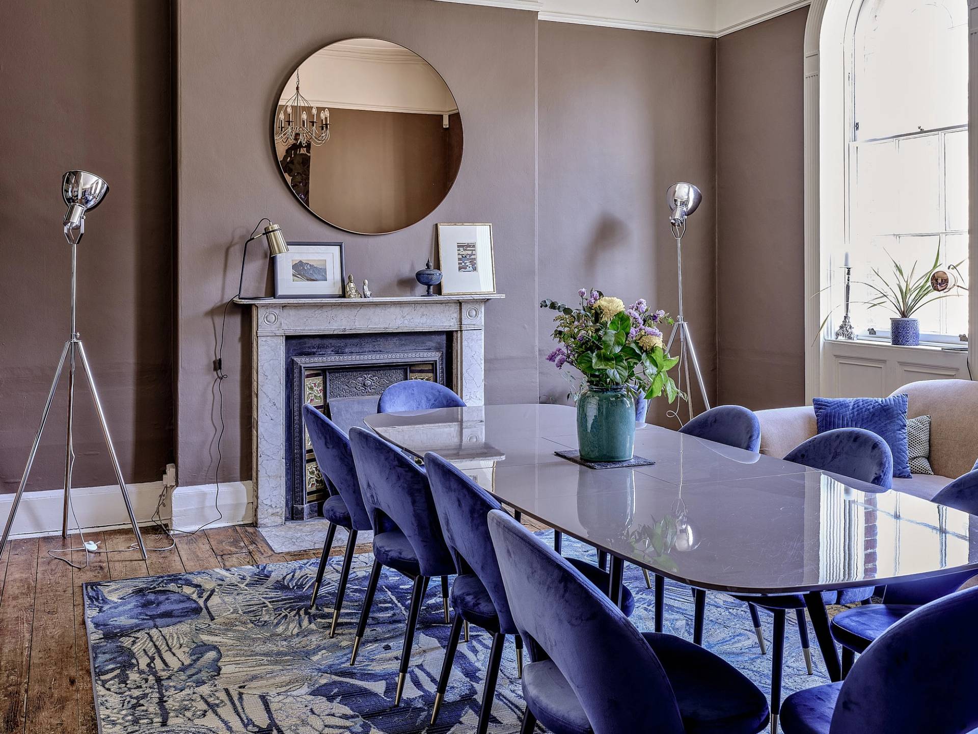 Formal dining room featuring taupe walls, long grey dining table, blue velvet chairs, and a period marble fireplace, ideal for luxury tableware campaigns, Love Locations ME13.