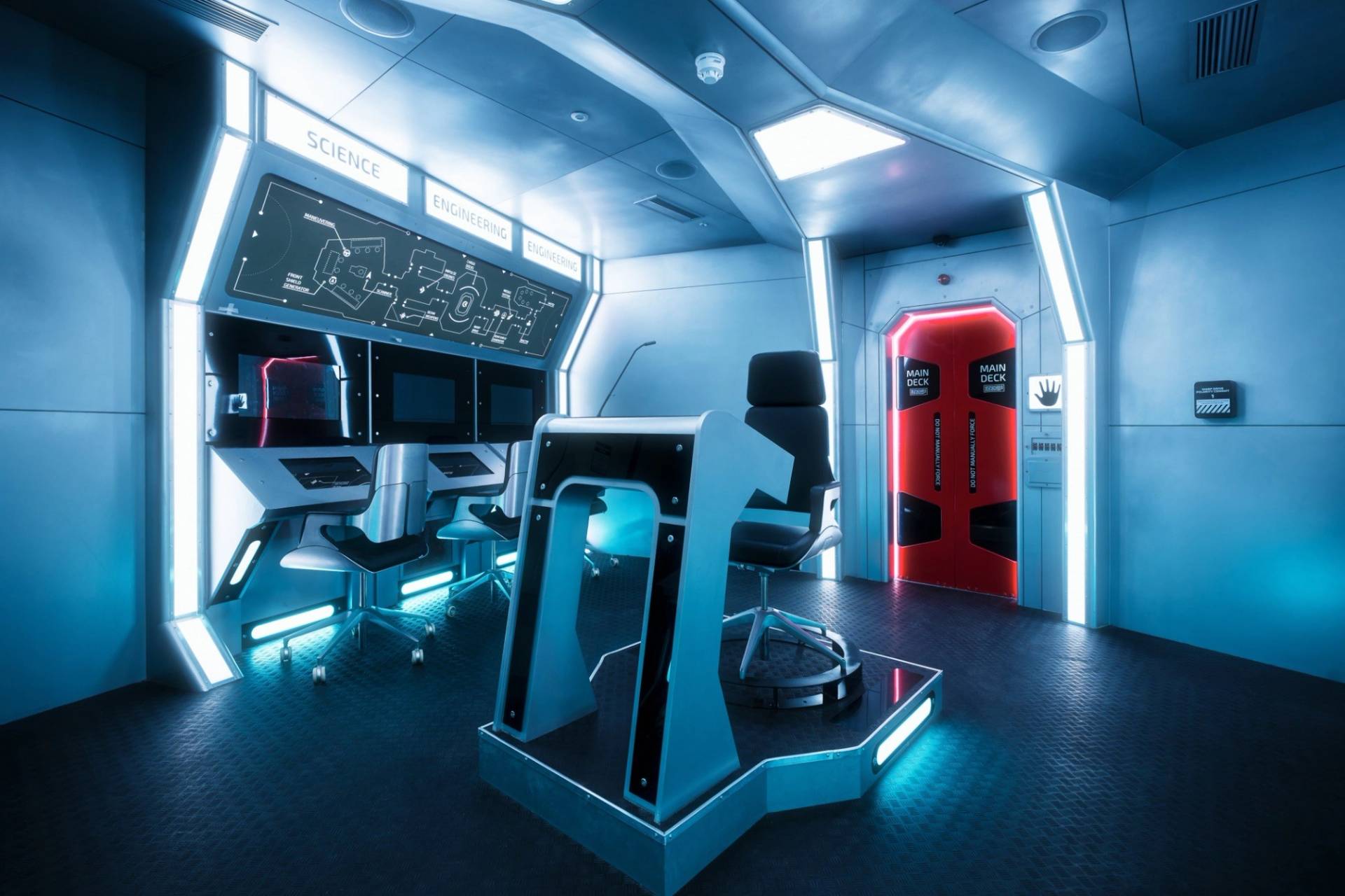 Futuristic spaceship command console next to a blast door entry, ideal for immersive filming and media hire via Love Locations.