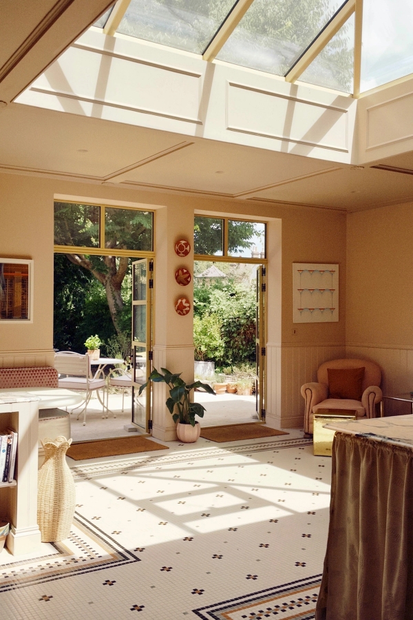 Bright conservatory seating area opening onto sunny garden grounds, ideal for family lifestyle brand shoots and TV set designs, Love Locations TW7.