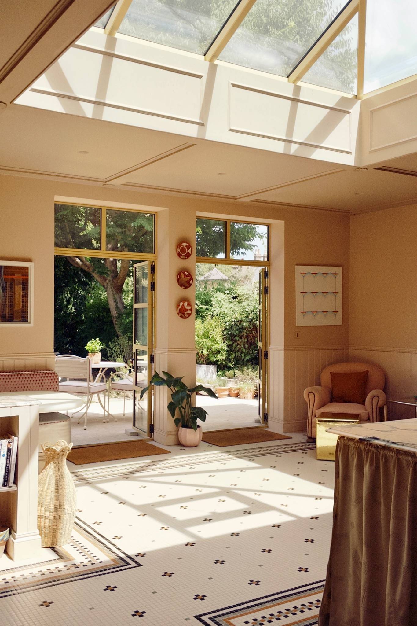 Bright conservatory seating area opening onto sunny garden grounds, ideal for family lifestyle brand shoots and TV set designs, Love Locations TW7.