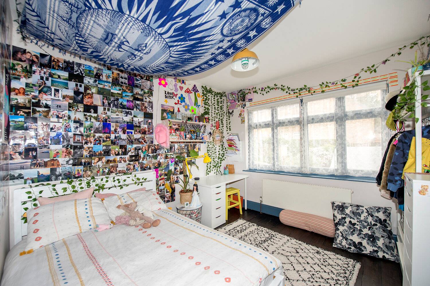 Teen bedroom suite with celestial blue tapestries, wall photo collage, and white bedlinen in Forest Hill, Love Locations SE23.