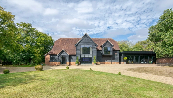 Gated entrance leading to private barn property in Essex, Love Locations