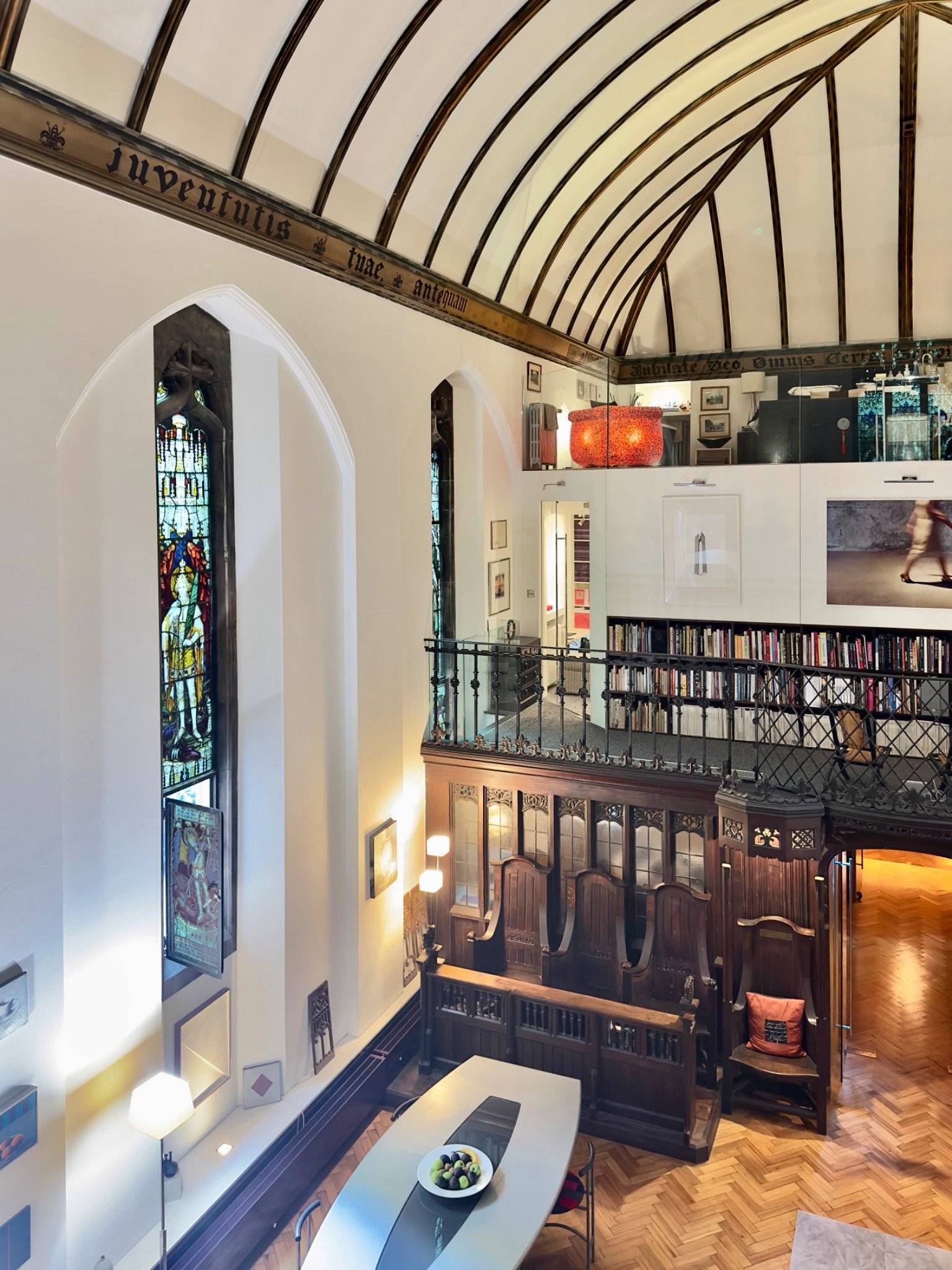 Mezzanine gallery balcony overview looking out across stained glass windows in a converted chapel film location in Oval SE5 from Love Locations.