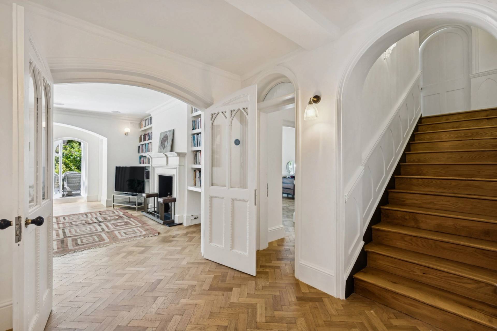 Bright hallway and staircase transition shoot space in a Hampstead London location house curated by Love Locations.