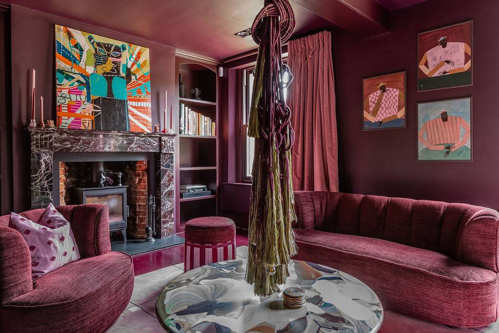 Atmospheric burgundy-walled formal lounge and library shoot location in Liss Hampshire GU33 from Love Locations, with matching plush velvet sofas.