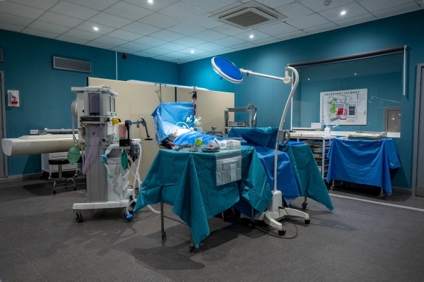 Surgical operating suite location with overhead medical lights and patient table for film productions, Love Locations UB4.