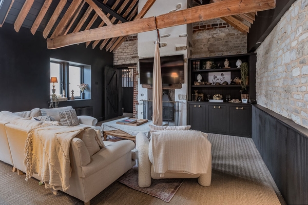 Love Locations airy living room with high vaulted ceilings.