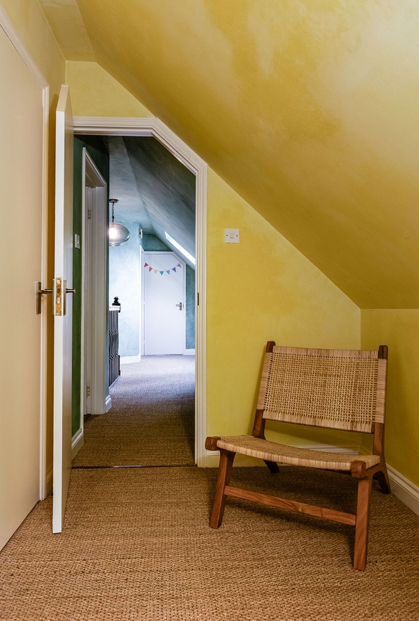 Loft hallway with colourful interiors and vaulted ceilings at Love Locations filming location in Liss, Hampshire GU33.