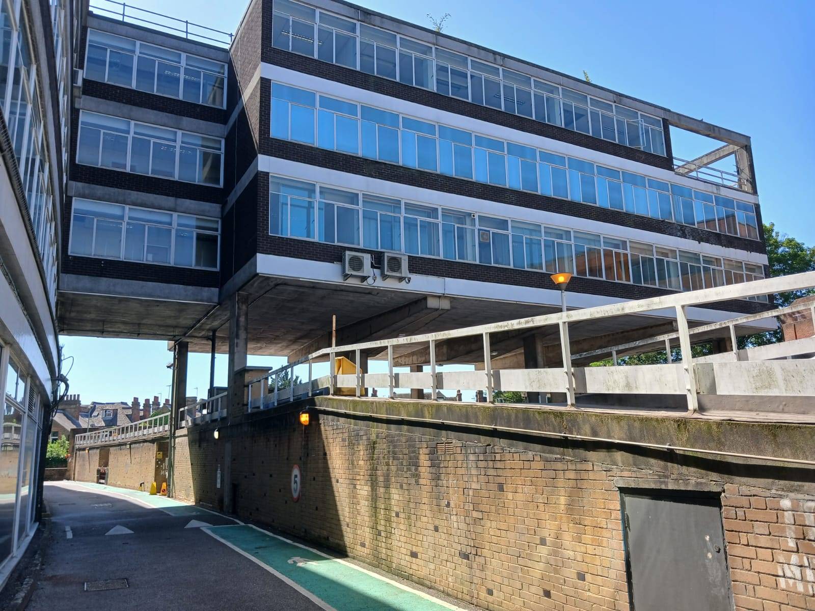 Urban brutalist concrete structure and raised walkway location home in Watford WD18 through Love Locations, perfect for gritty cinematic backdrops.