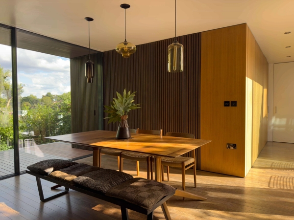 Courtyard-facing living room at Highgate Zen Love Locations home with open-plan layout.
