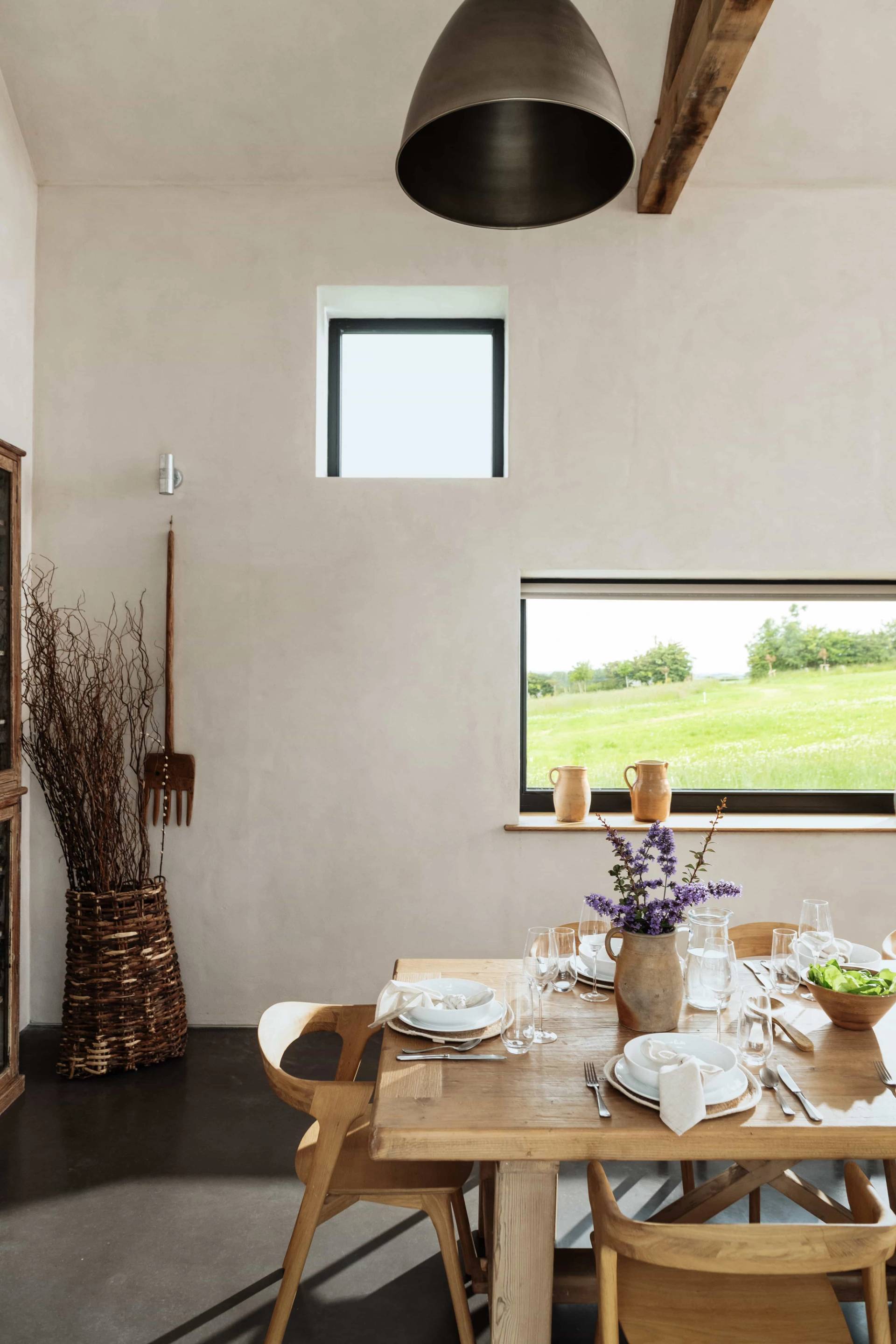 Cozy window nook and dining corner shoot location in Castleblayney County Monaghan Ireland by Love Locations, displaying neutral plastered walls, dried botanicals, and natural sunlight.