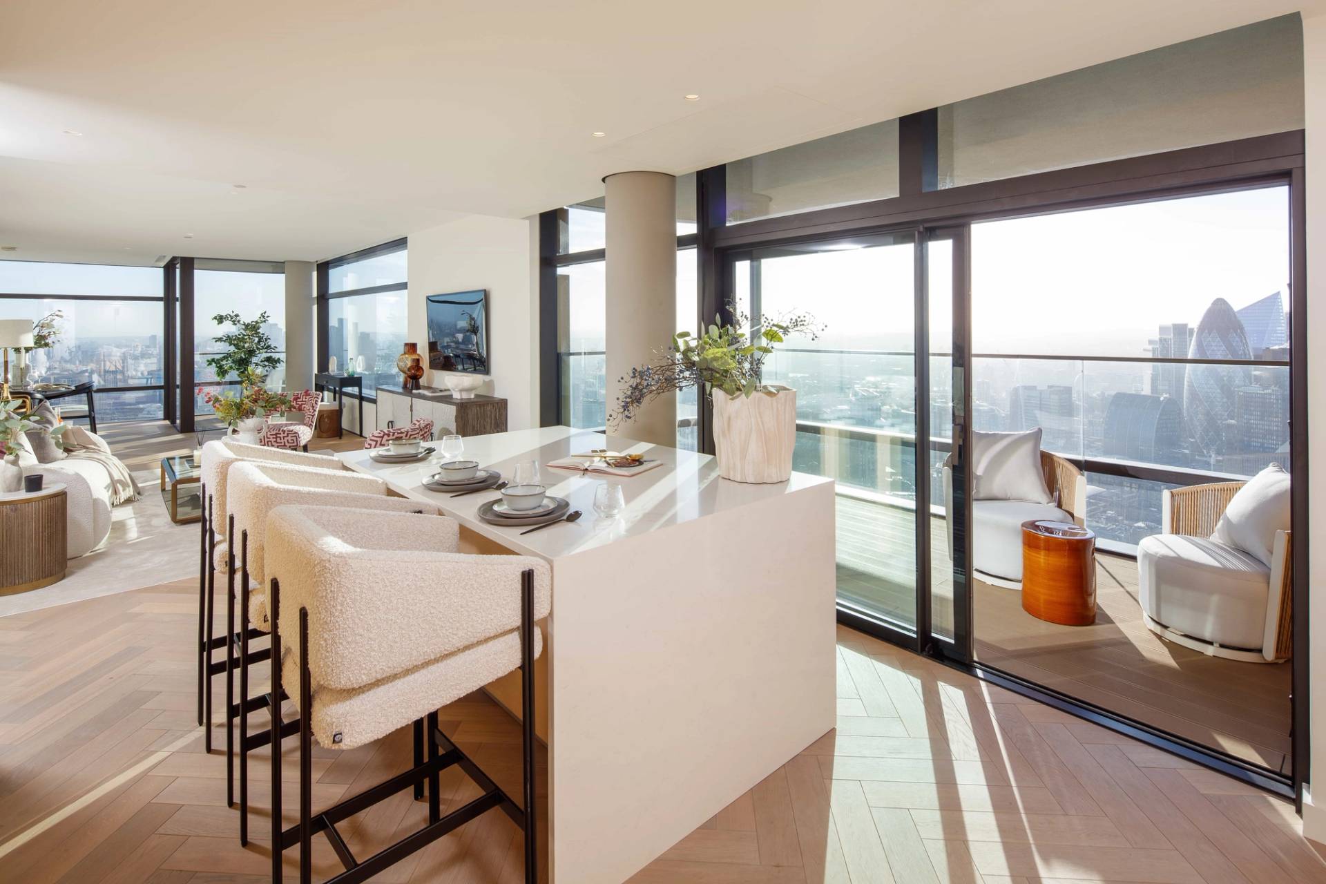 Kitchen island breakfast bar view looking through glass sliding doors onto a private high-rise terrace, perfect for morning lifestyle shoots, Love Locations EC2A.