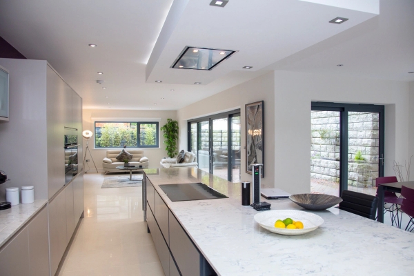 High-end open-plan kitchen location looking through large glass doors, excellent for morning lifestyle brand commercials, listed on Love Locations.