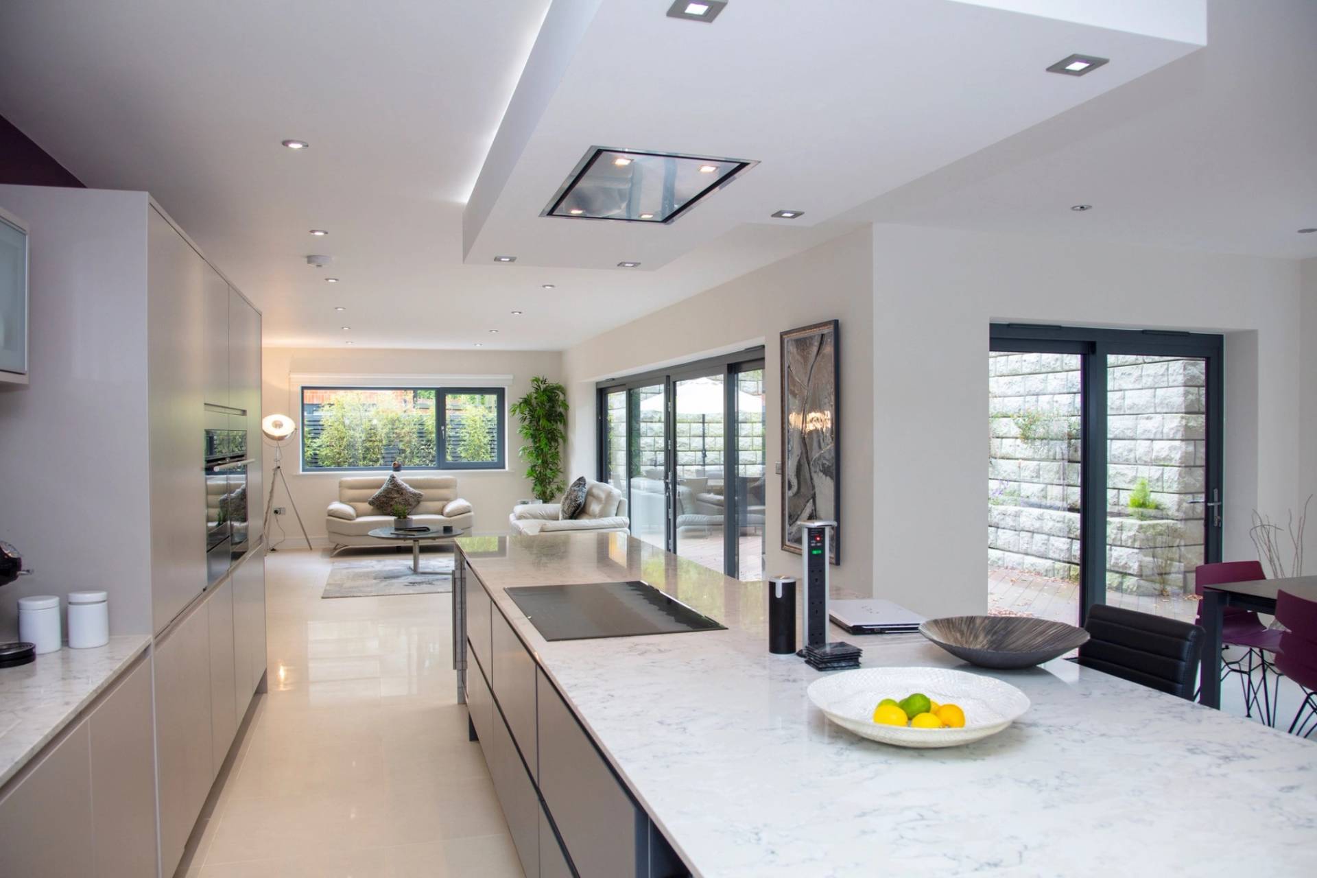 High-end open-plan kitchen location looking through large glass doors, excellent for morning lifestyle brand commercials, listed on Love Locations.