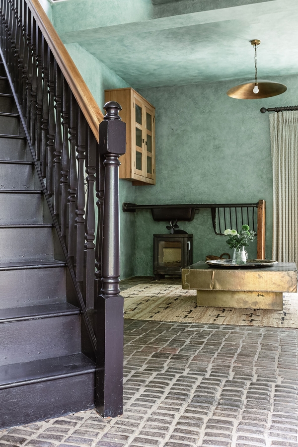 Open-plan entrance with staircase, brick flooring and character interiors at Love Locations property in Liss, Hampshire GU33.