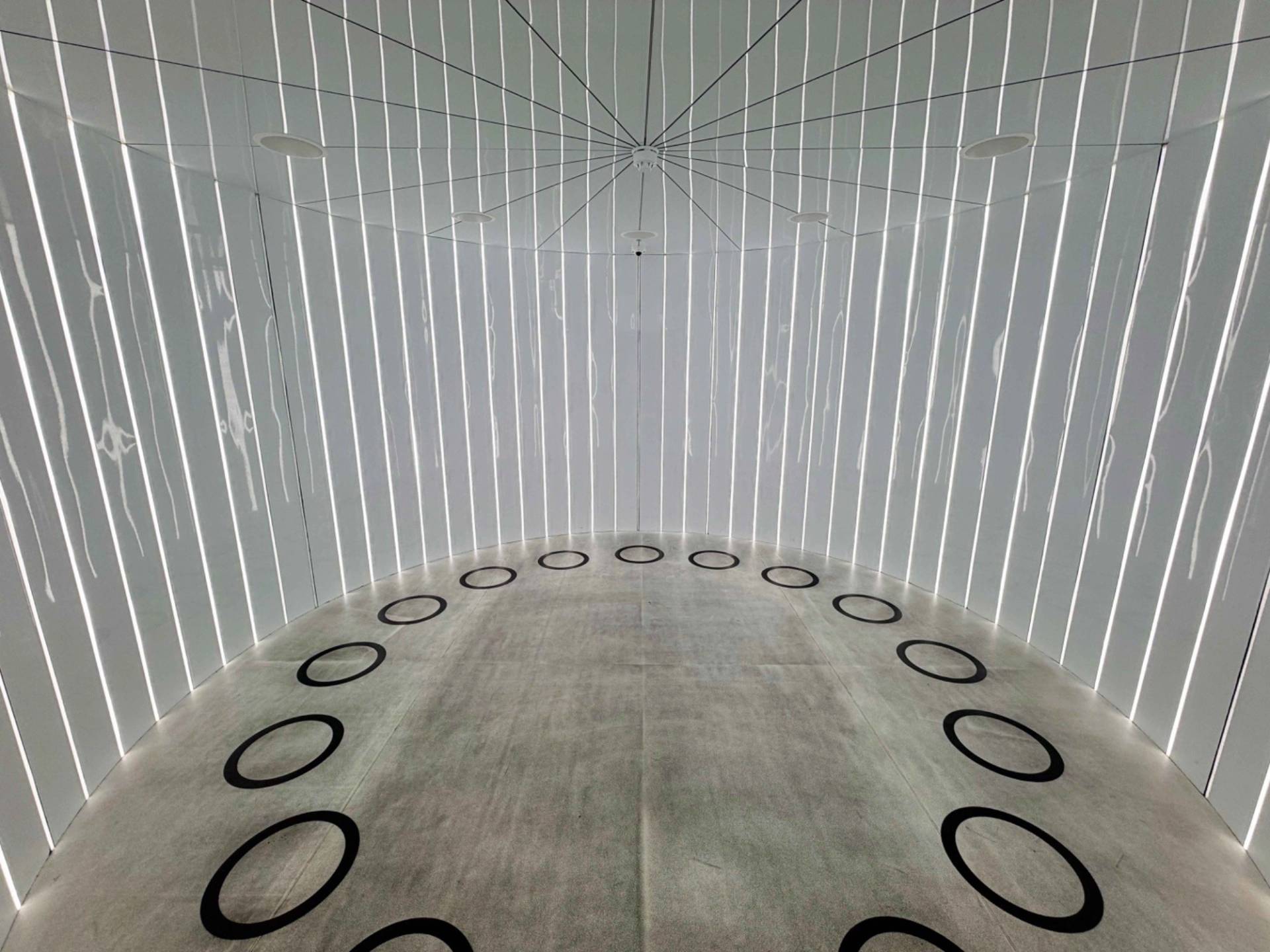 Abstract futuristic warp core or teleportation room location space with vertical white strip lighting, Love Locations Lambeth.