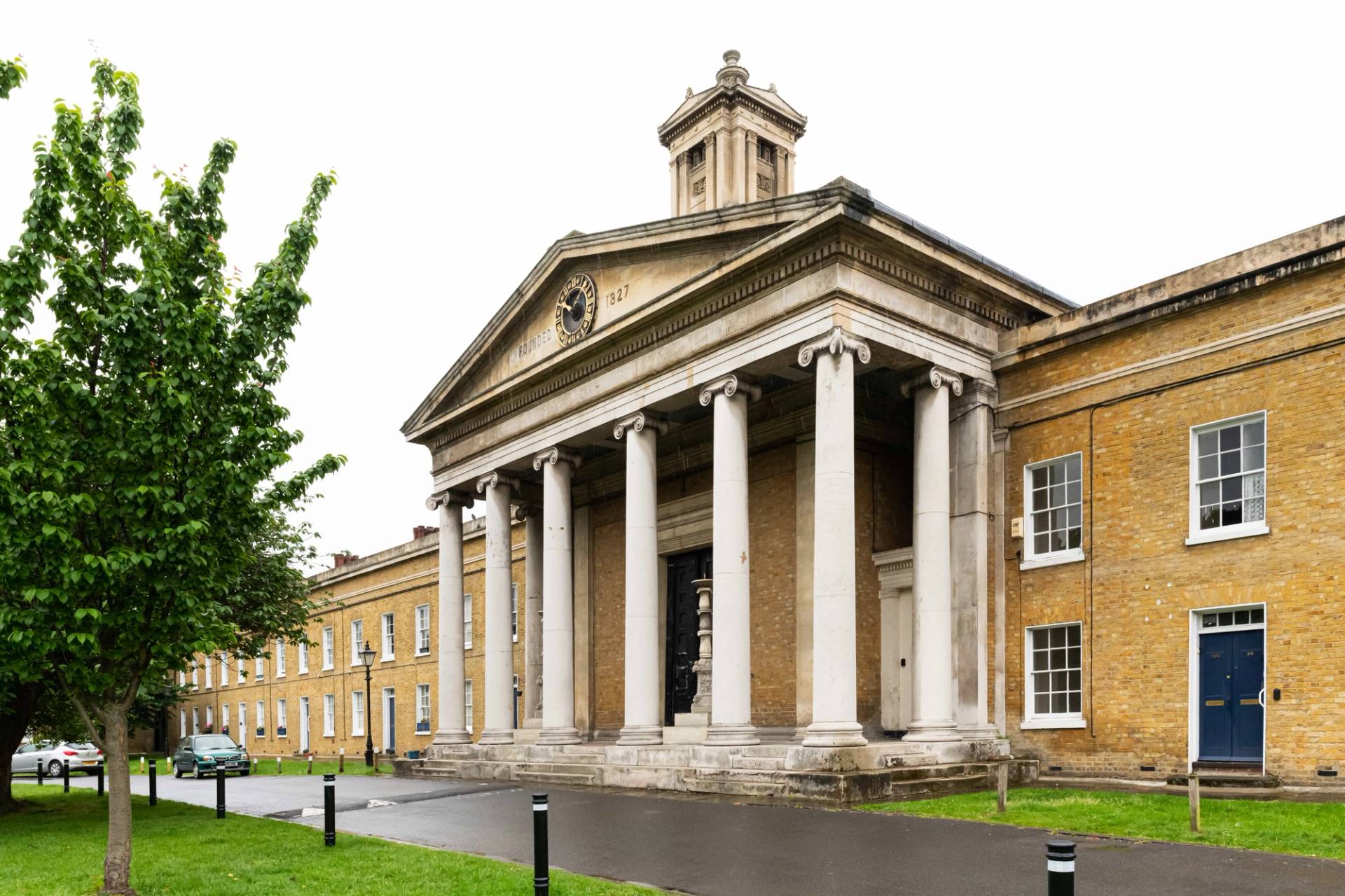 Grand Georgian chapel exterior featuring stone columns and portico entrance in South East London, perfect for TV drama establishing shots, Love Locations.